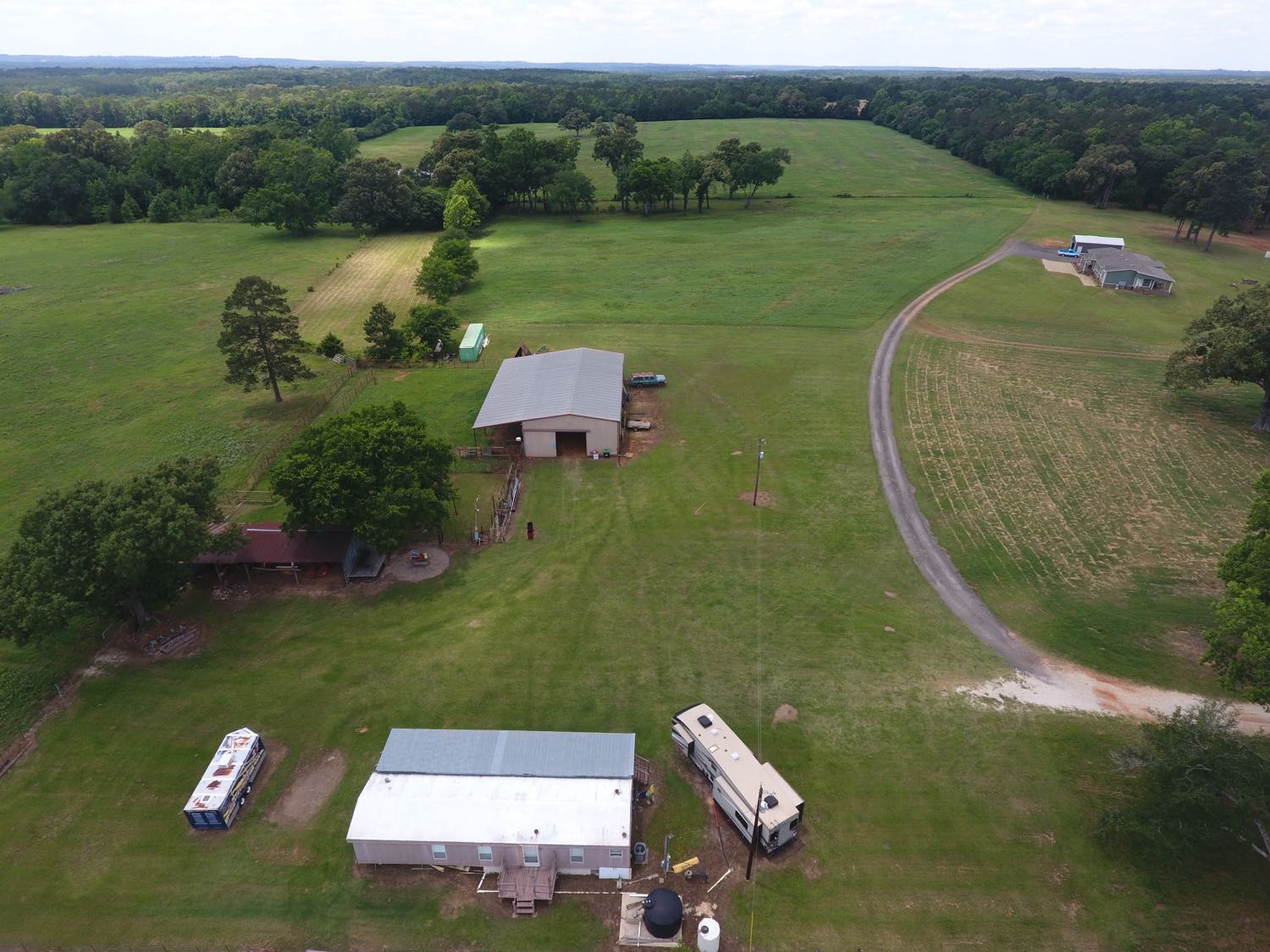 Aerial of the home, barn and drive