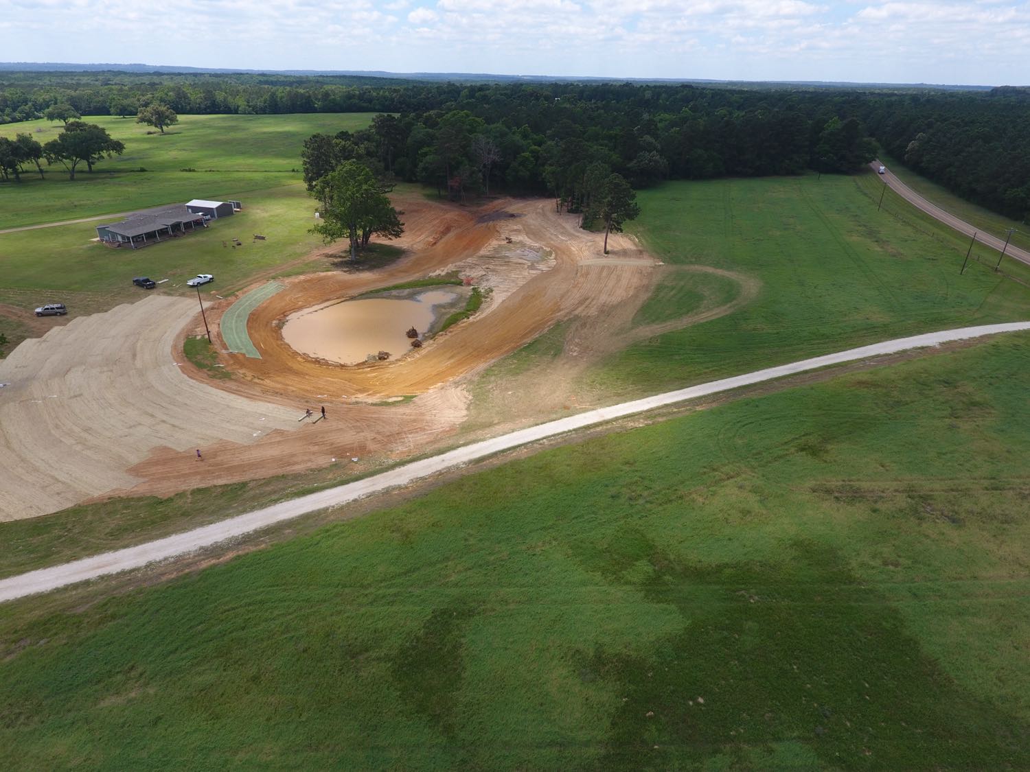 Aerial of the barn and pond being expanded